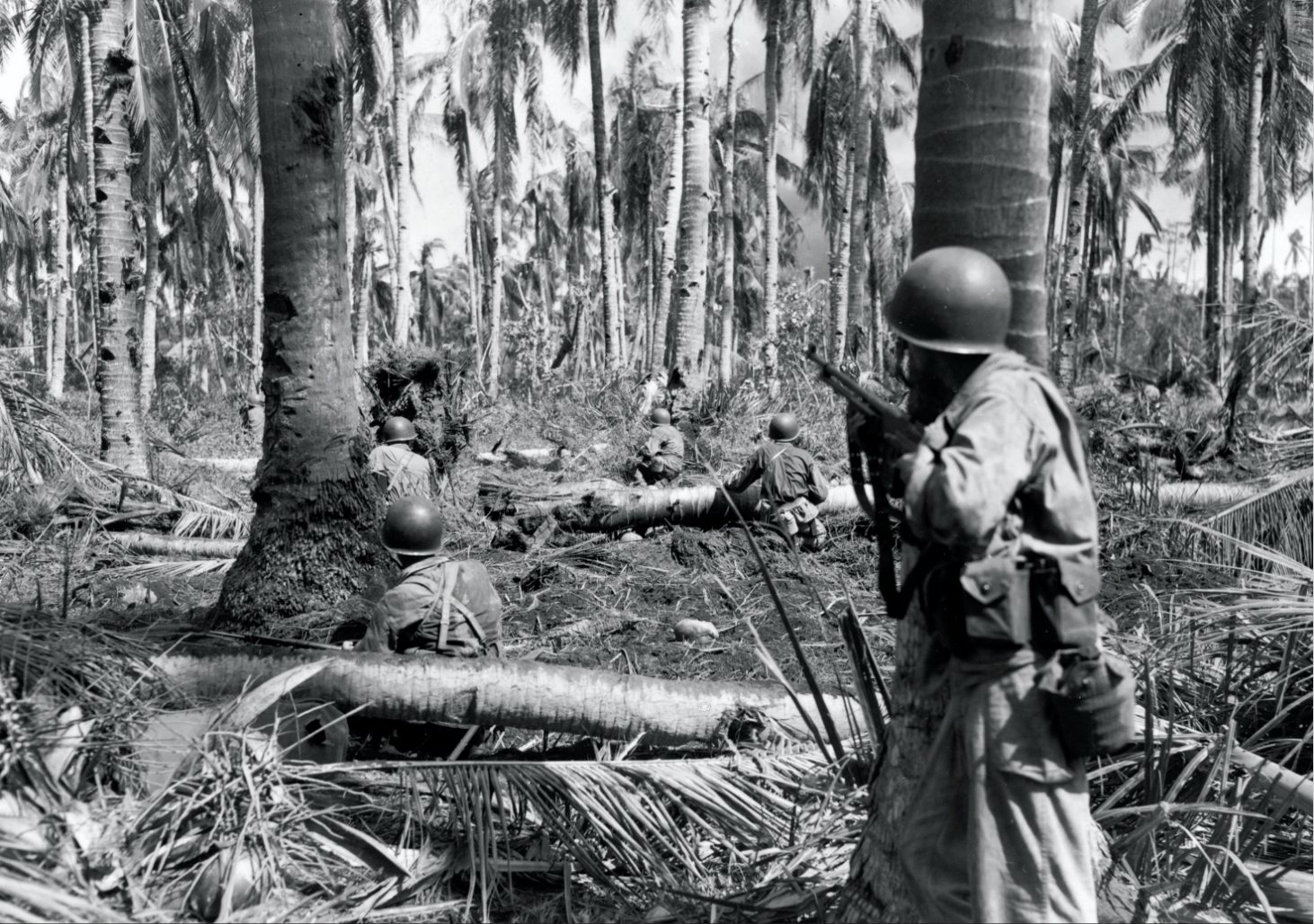 Members of F Troop, 7th Regiment, 1st Cavalry Division, are pinned down after getting 50 feet inland from White Beach, Leyte Island, Philippines,while heading for San Jose, October 21, 1944 (National Archives and Records Administration/Field/U.S. Army Signal Corps)